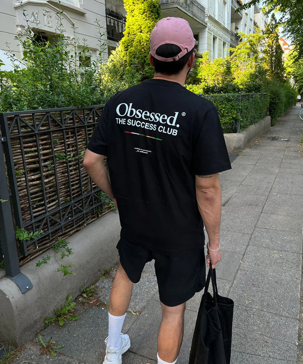 Oxvyn Oversized Obsessed T-Shirt in black, casual streetwear essential, side view